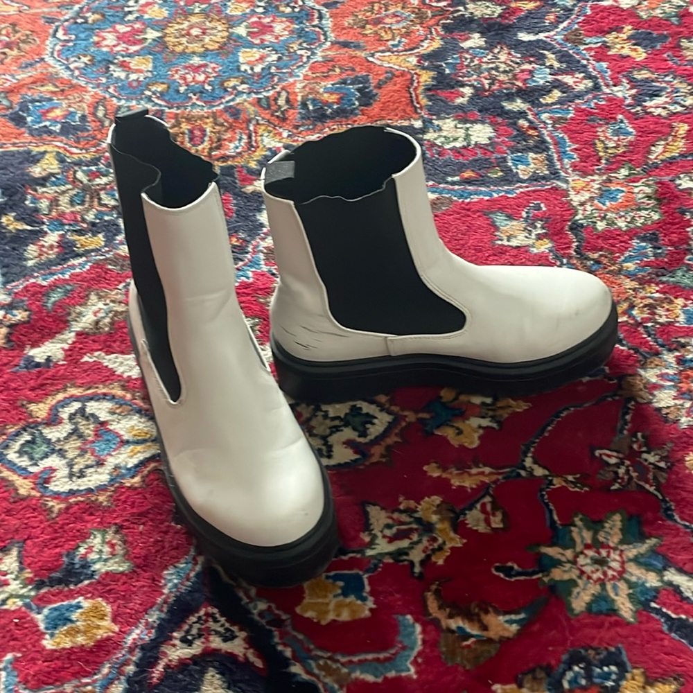 White ankle boots with black lug soles